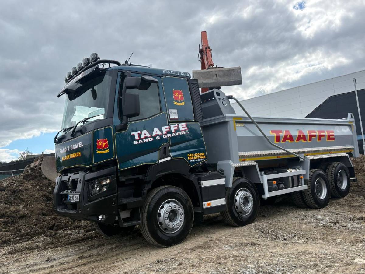 Digger loading a Taaffe eight-wheel tipper on site