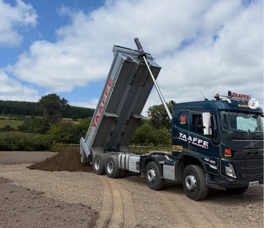 Taaffe eight-wheel tipper discharging a load on site